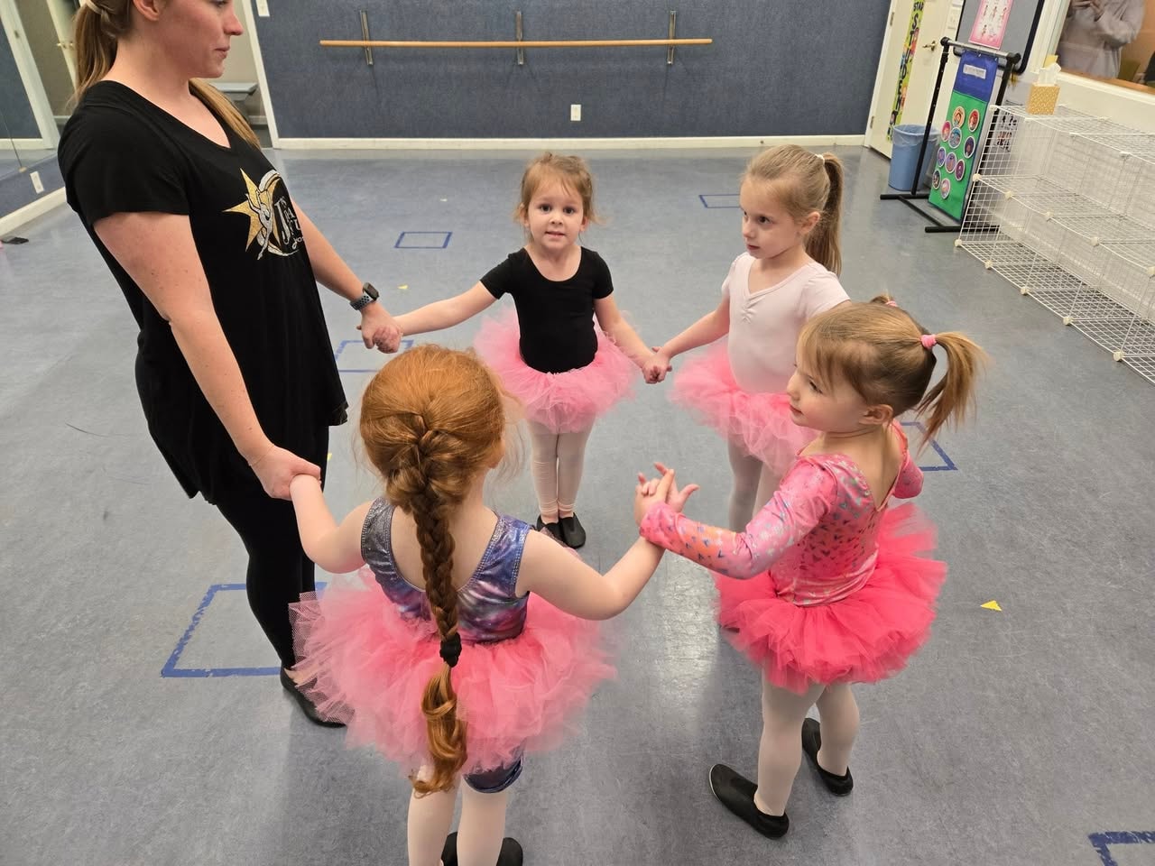 J's Dance Studio class at the barre in white tutus