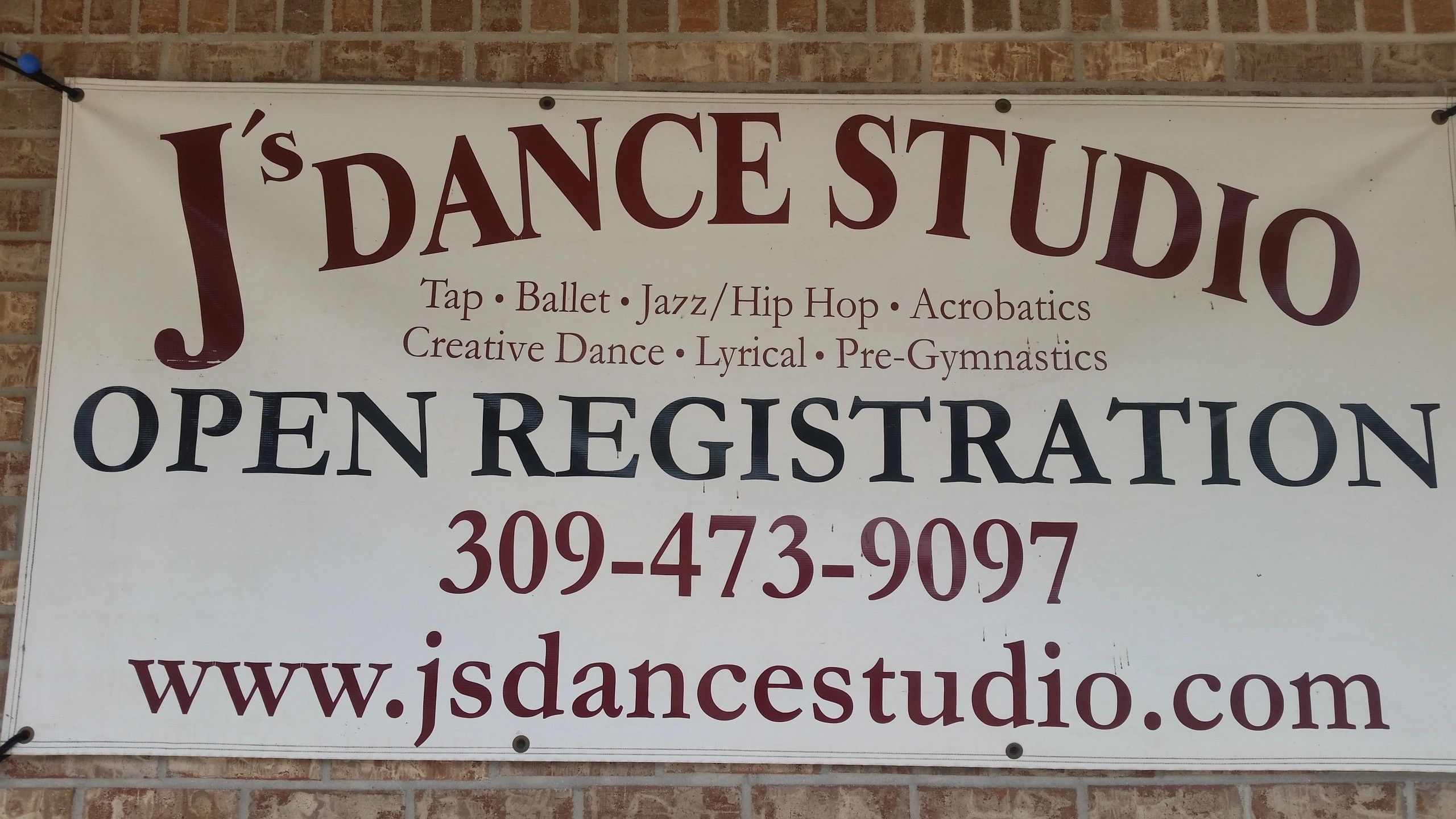 J's Dance Studio sign listing classes: Tap, Ballet, Jazz/Hip Hop, Acrobatics, Creative Dance, Lyrical, Pre-Gymnastics